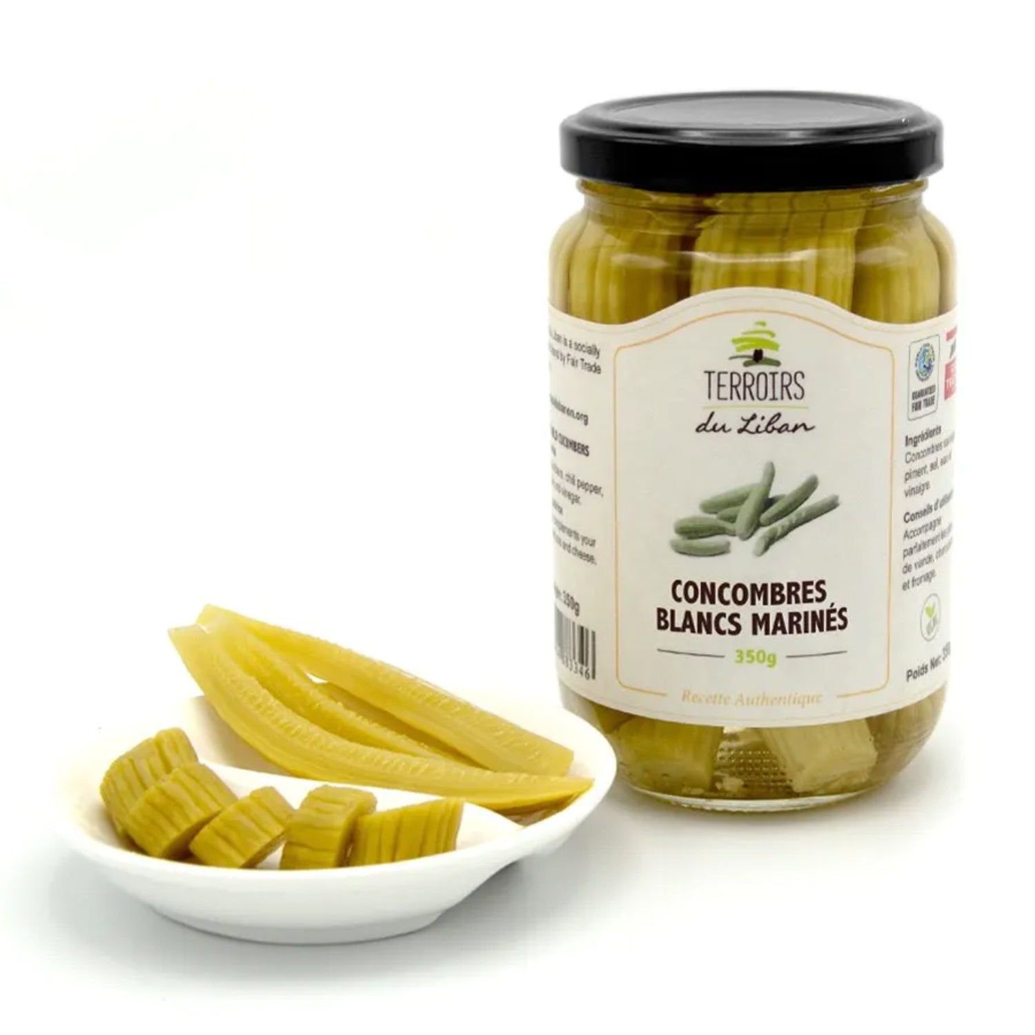 "Ein Glas Eingelegte weiße Gurken, 350g, neben einer kleinen Schale mit geschnittenen marinierten Gurken.\t"